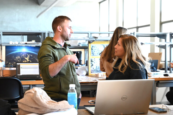 2 students in studio talking